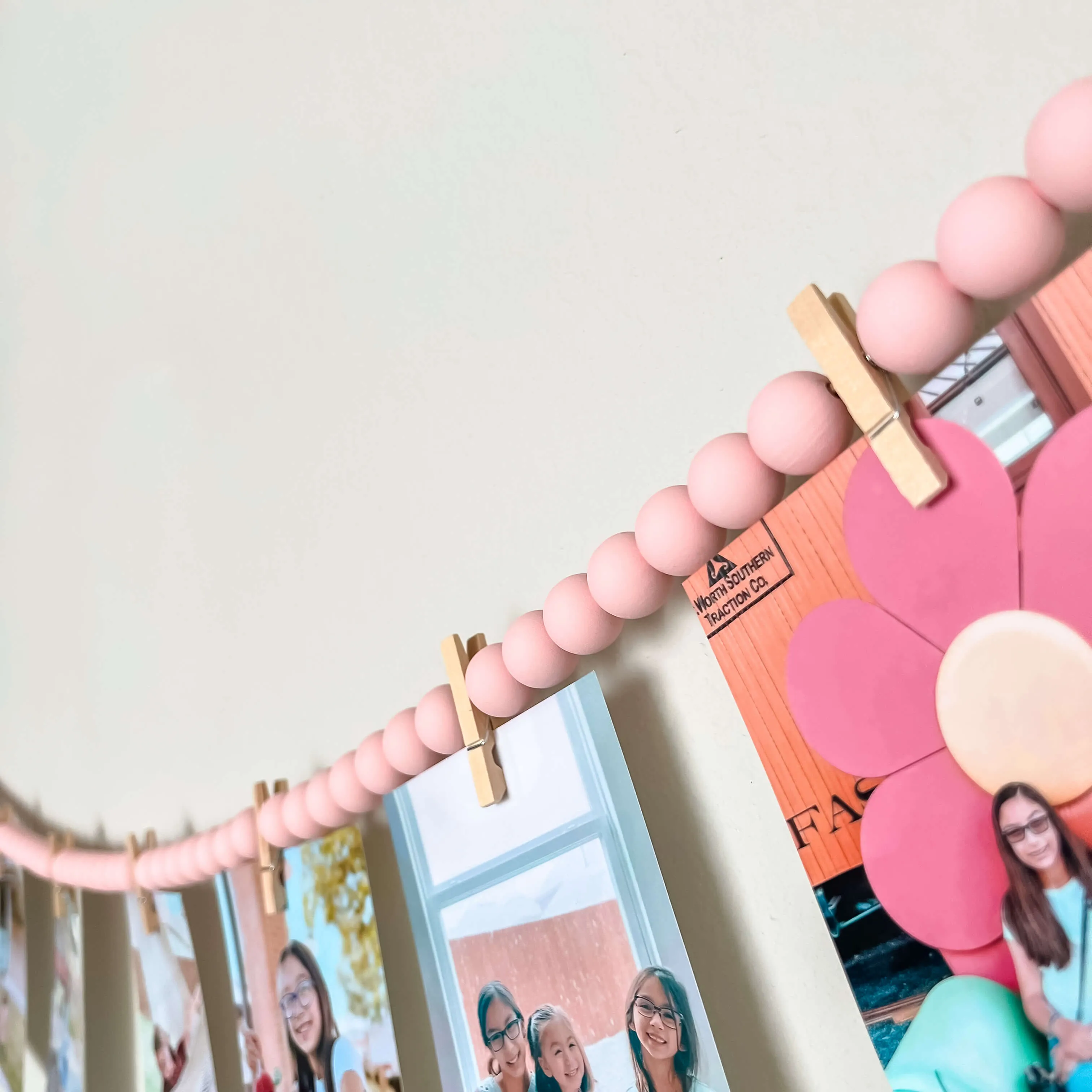 Photo display with 12 clothespins